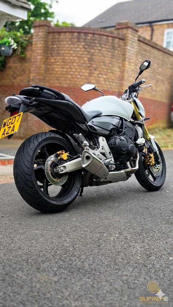 White Honda Hornet 600 — rear on road